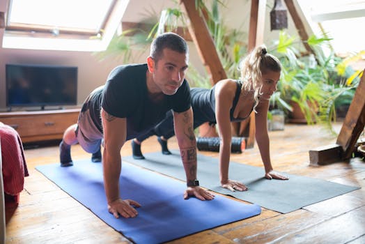 Man and woman doing yoga together at home, emphasizing fitness and healthy lifestyle.