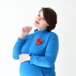 a woman in business, mom, a pregnant business-woman